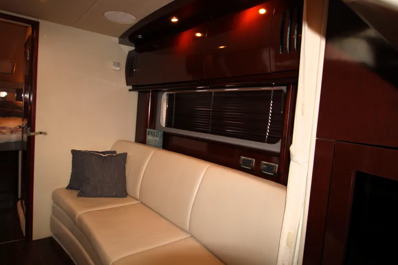 Slide: The Image of Luxurious interior of 2008 Sea Ray 38 Sundancer with leather seating and wood accents. - 34