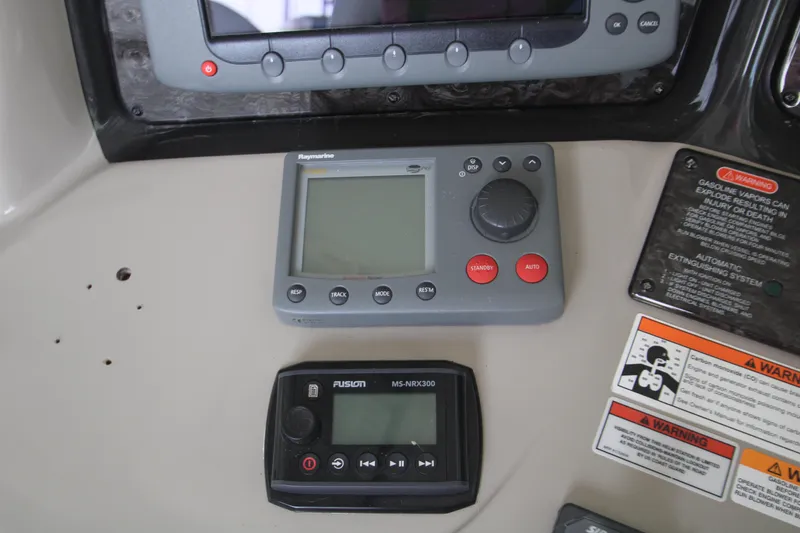 Slide: The Image of Control panel of a 2008 Sea Ray 38 Sundancer boat with navigation and audio systems. - 27