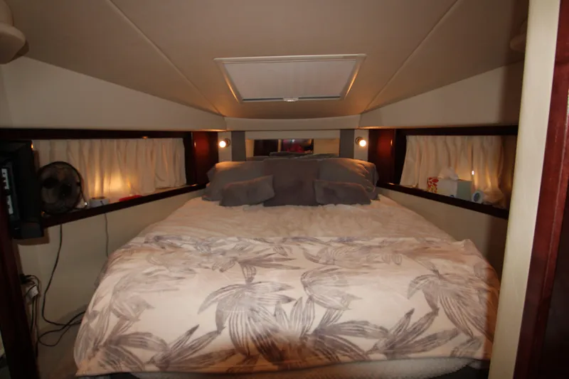 Slide: The Image of Luxurious bedroom interior of 2008 Sea Ray 38 Sundancer yacht with cozy bedding. - 41