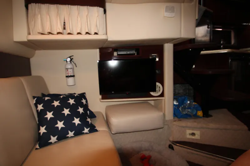 Slide: The Image of Interior of 2008 Sea Ray 38 Sundancer with TV, star pillow, and fire extinguisher. - 49