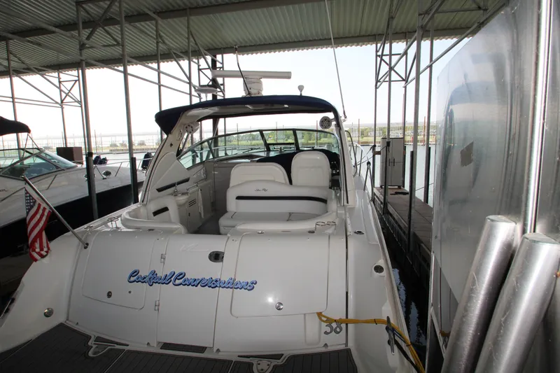 Slide: The Image of 2008 Sea Ray 38 Sundancer docked in marina, rear view. - 8