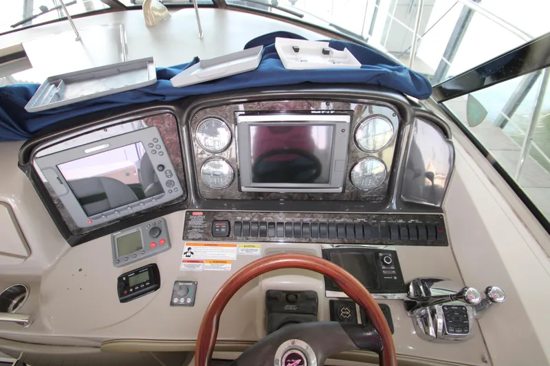 Slide: The Image of 2008 Sea Ray 38 Sundancer helm with navigation instruments and controls. - 28