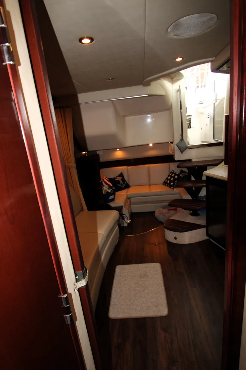 Slide: The Image of Interior of 2008 Sea Ray 38 Sundancer yacht with cozy seating and modern amenities. - 43