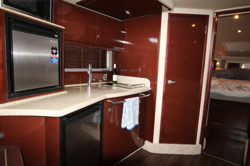 Slide: The Image of Luxurious 2008 Sea Ray 38 Sundancer yacht interior with modern kitchen amenities. - 2