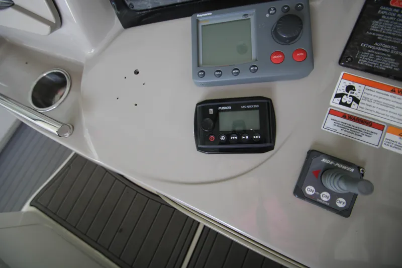Slide: The Image of Control panel of a 2008 Sea Ray 38 Sundancer boat with navigation equipment. - 32