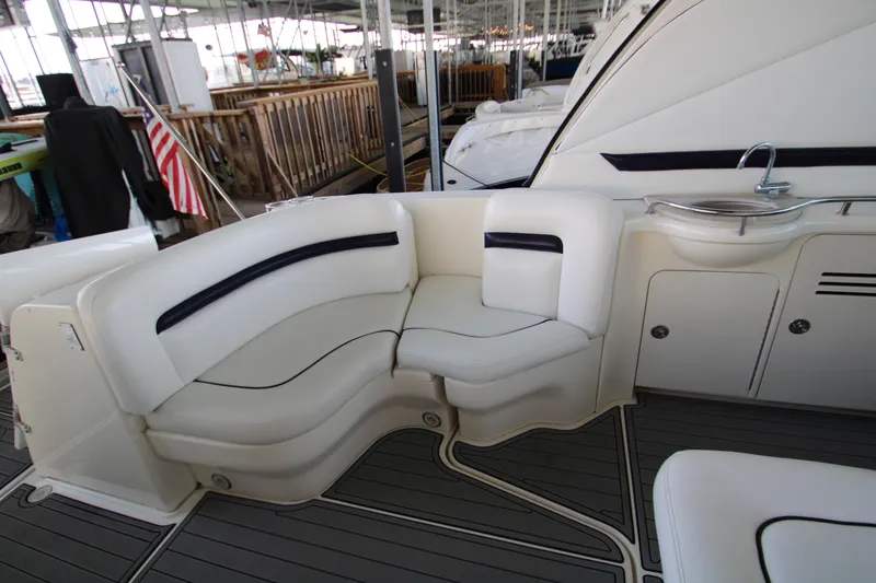 Slide: The Image of 2008 Sea Ray 38 Sundancer yacht interior with white seating and sink. - 11