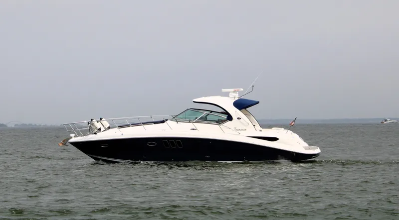 Slide: The Image of 2008 Sea Ray 38 Sundancer yacht cruising on open water. - 4