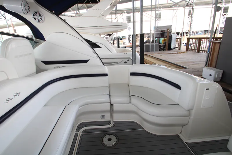 Slide: The Image of 2008 Sea Ray 38 Sundancer yacht interior with white seating and sleek design. - 10
