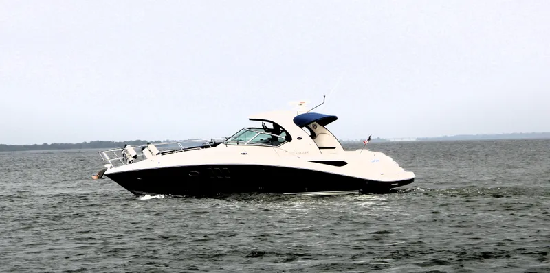 Slide: The Image of 2008 Sea Ray 38 Sundancer cruising on open water. - 5