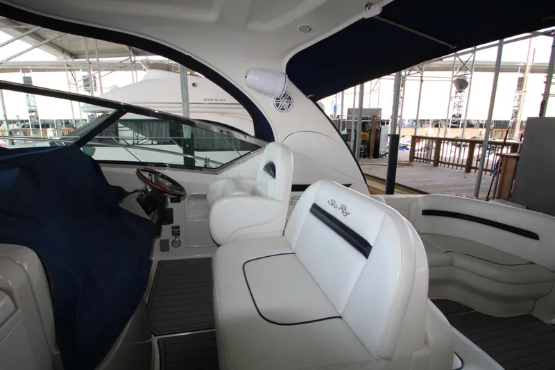 Slide: The Image of Interior of 2008 Sea Ray 38 Sundancer yacht with white seating and modern design. - 14