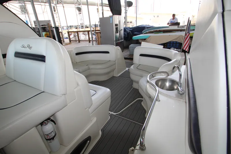 Slide: The Image of 2008 Sea Ray 38 Sundancer interior with seating and sink. - 16
