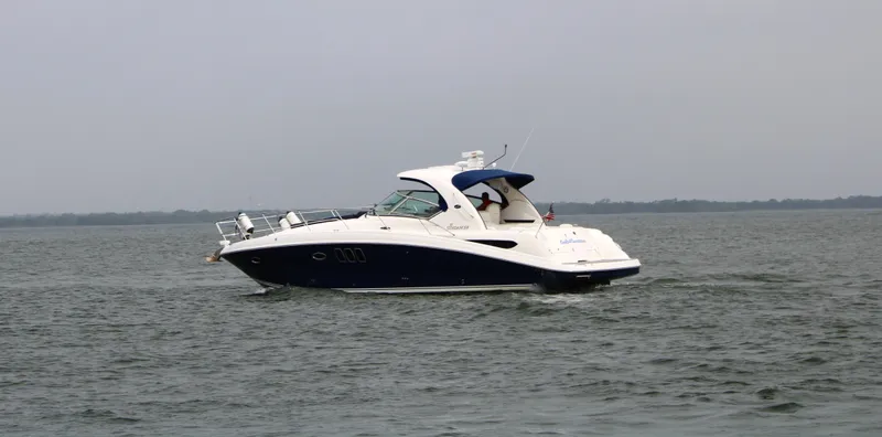 Slide: The Image of 2008 Sea Ray 38 Sundancer cruising on open water. - 6