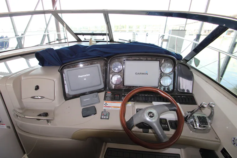 Slide: The Image of 2008 Sea Ray 38 Sundancer helm with Garmin navigation system and steering wheel. - 20