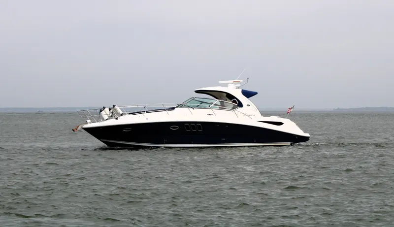 Slide: The Image of 2008 Sea Ray 38 Sundancer yacht cruising on open water. - 3