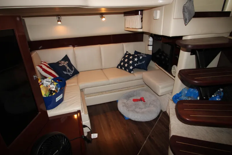 Slide: The Image of Interior of 2008 Sea Ray 38 Sundancer with cozy seating and nautical decor. - 48