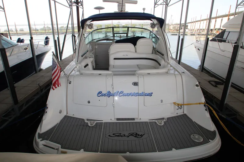 Slide: The Image of 2008 Sea Ray 38 Sundancer yacht docked, rear view with American flag. - 7