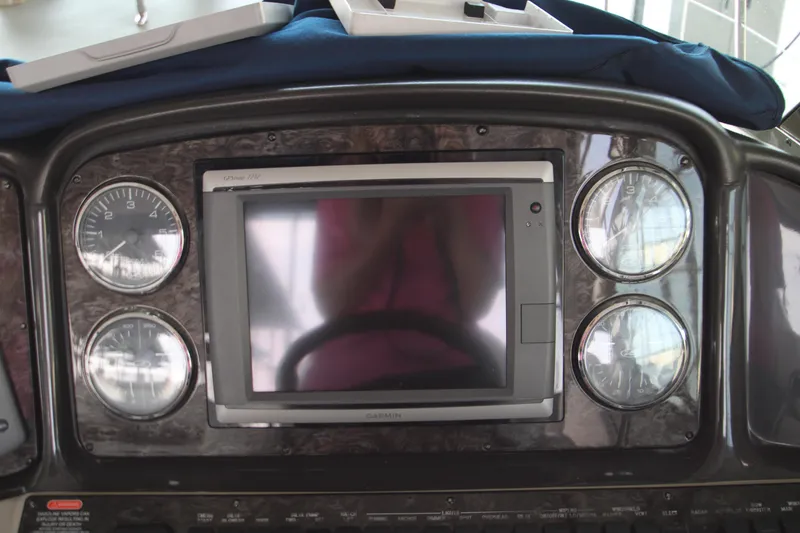 Slide: The Image of Dashboard of 2008 Sea Ray 38 Sundancer with gauges and display screen. - 25