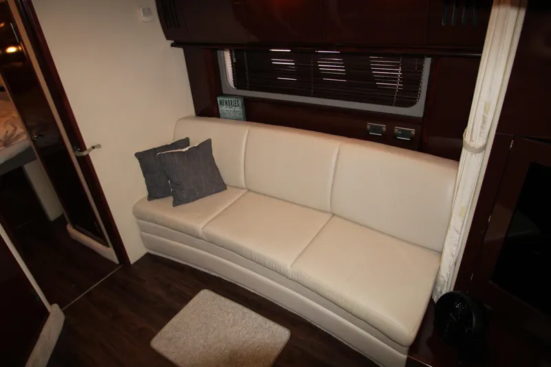 Slide: The Image of Luxurious interior of 2008 Sea Ray 38 Sundancer with cream leather sofa. - 33