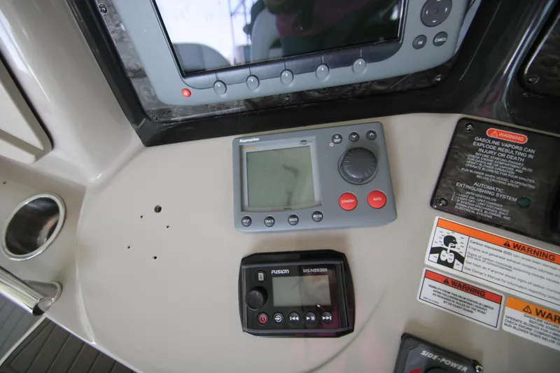 Slide: The Image of Control panel of 2008 Sea Ray 38 Sundancer with navigation and warning displays. - 31