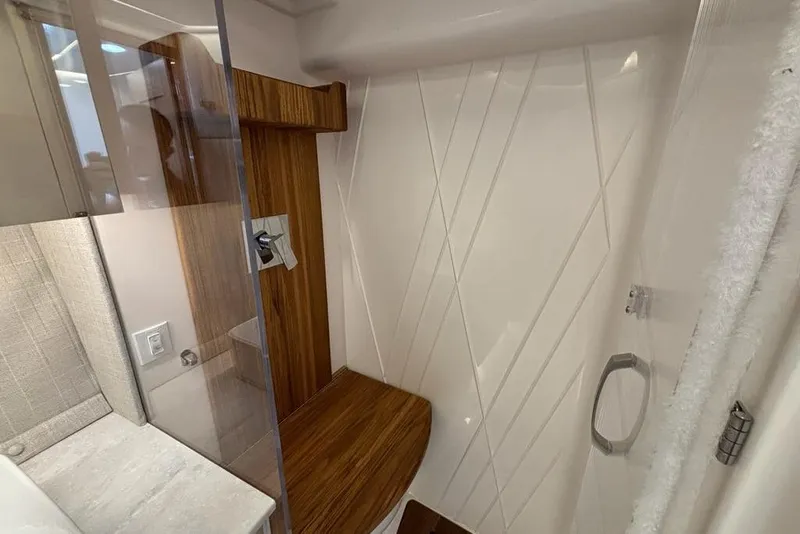 Slide: The Image of Modern bathroom interior of 2026 Regal 36 XO yacht with wood accents and sleek design. - 59