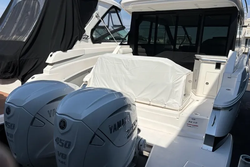 Slide: The Image of 2026 Regal 36 XO yacht with twin Yamaha 450 V8 engines at dock. - 48