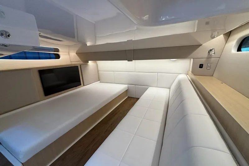 Slide: The Image of Luxurious interior of 2026 Regal 36 XO yacht with modern seating and sleek design. - 57