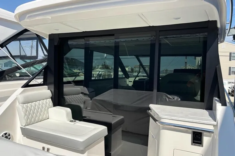 Slide: The Image of 2026 Regal 36 XO yacht interior with sleek seating and modern design. - 49