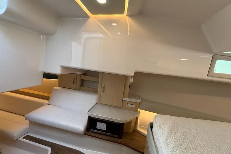 Slide: The Image of Interior of 2026 Regal 36 XO yacht with modern seating and cabinetry. - 55