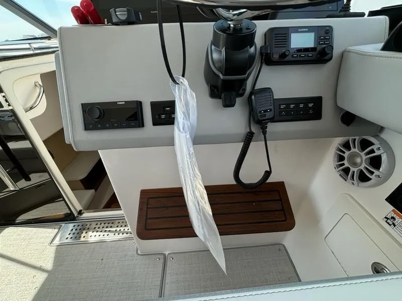 Slide: The Image of Control panel of 2025 Regal 36 XO boat with navigation equipment and speaker. - 35
