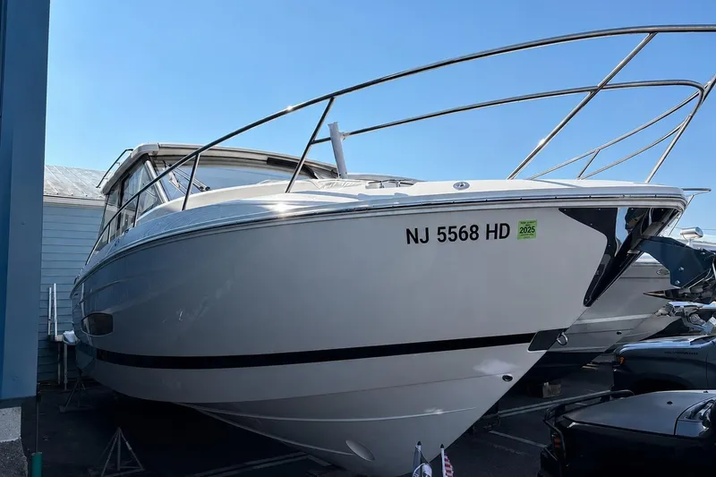 Slide: The Image of 2026 Regal 36 XO boat docked, displaying registration number NJ 5568 HD. - 61