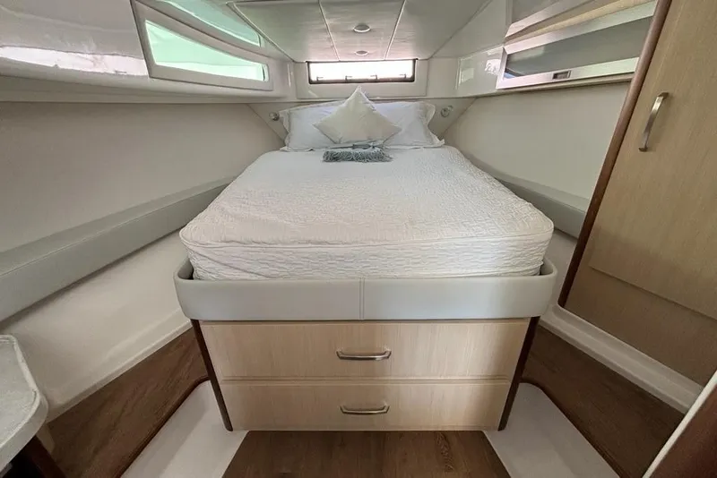 Slide: The Image of Luxurious cabin interior of 2026 Regal 36 XO yacht with cozy bed and modern design. - 50