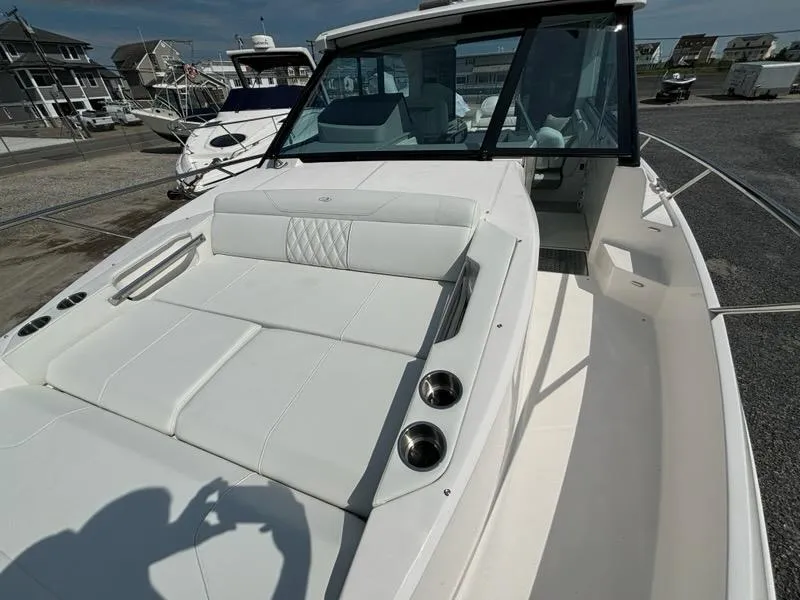 Slide: The Image of Luxurious 2026 Regal 36 XO boat with sleek white upholstery. - 43