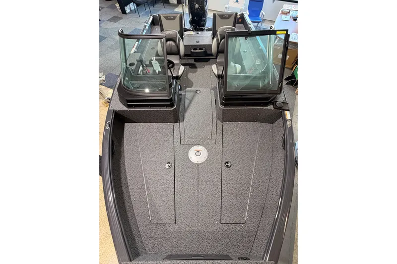 Slide: The Image of 2027 Lund 1700 Explorer Sport boat interior with dual windshields and spacious deck. - 18
