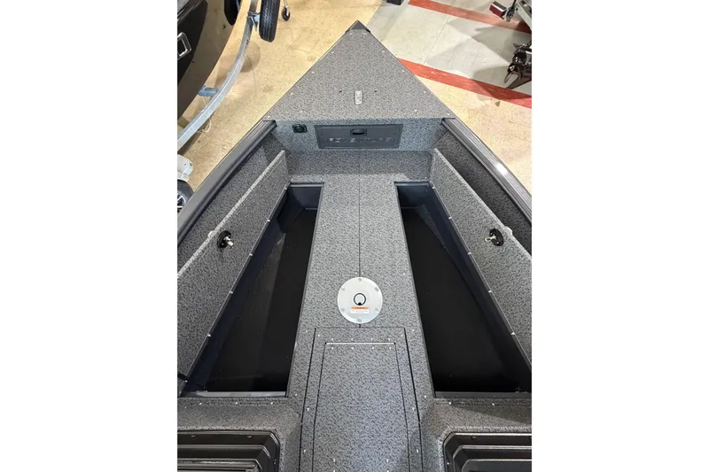 Slide: The Image of Interior view of 2027 Lund 1700 Explorer Sport boat, showcasing storage compartments. - 20