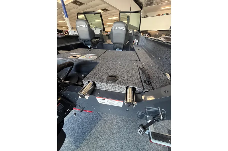 Slide: The Image of 2027 Lund 1700 Explorer Sport boat interior with seating and storage compartments. - 23