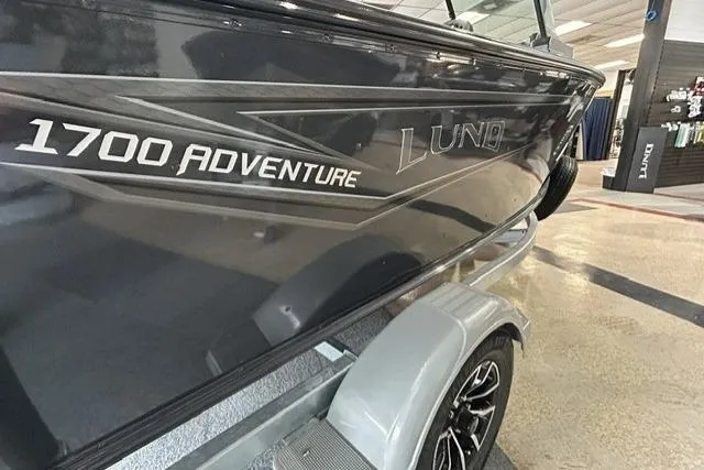Slide: The Image of 2027 Lund 1700 Explorer Sport boat on display in showroom. - 4