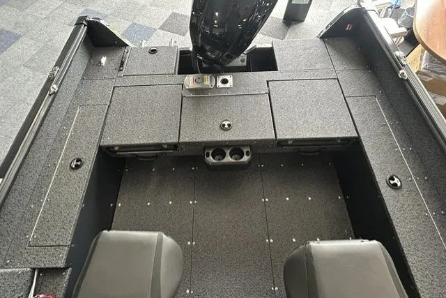 Slide: The Image of 2027 Lund 1700 Explorer Sport boat interior with seating and storage compartments. - 9