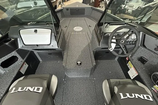 Slide: The Image of Interior view of 2027 Lund 1700 Explorer Sport boat with seating and steering console. - 8