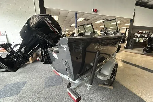 Slide: The Image of 2027 Lund 1700 Explorer Sport boat with Mercury engine displayed indoors. - 3
