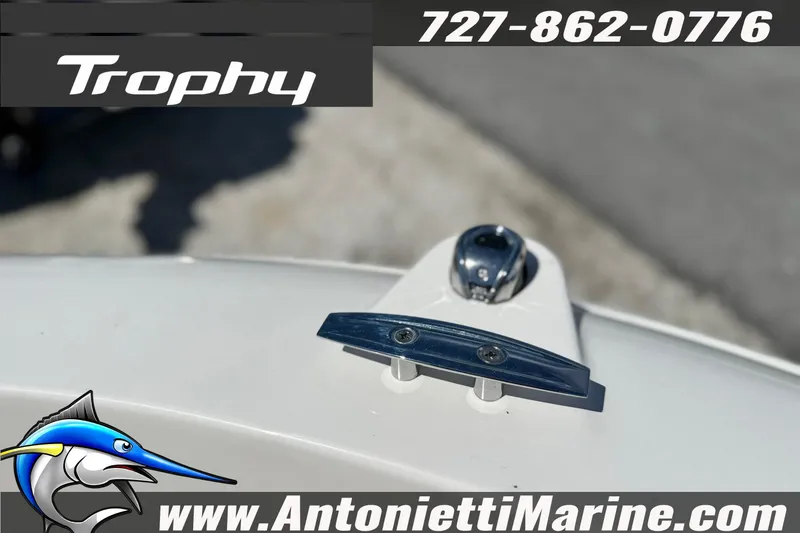 Slide: The Image of 2026 Bayliner Trophy T20CC boat detail with cleat and logo, Antonietti Marine contact info. - 31