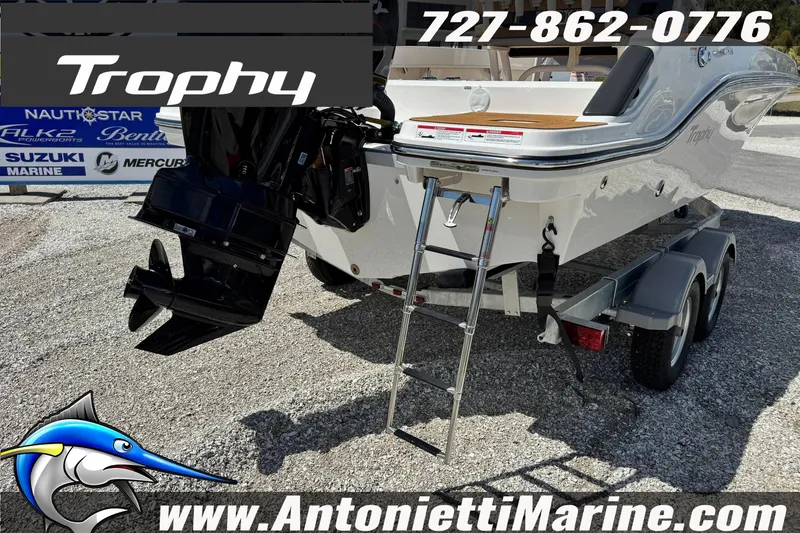 Slide: The Image of 2026 Bayliner Trophy T20CC boat on trailer with outboard motor and ladder. - 6