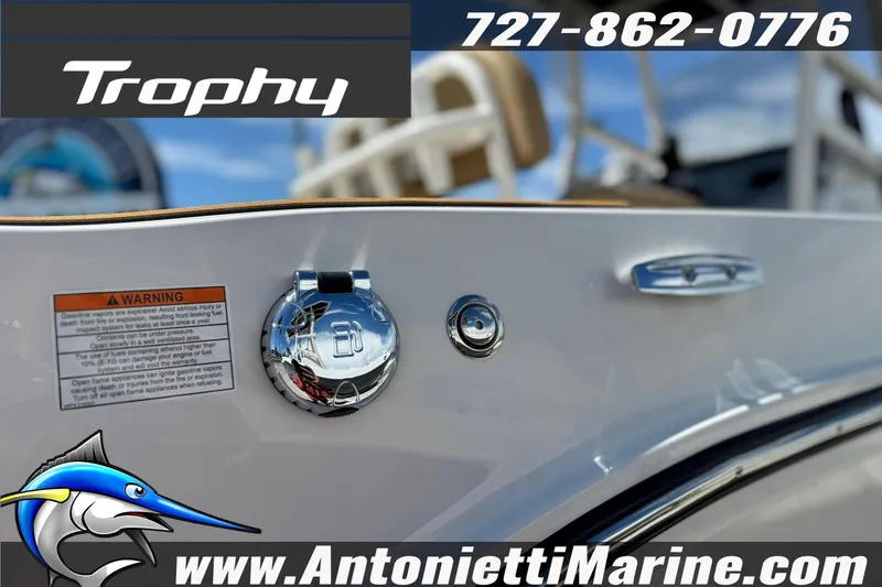 Slide: The Image of 2026 Bayliner Trophy T20CC boat detail with logo and contact information. - 33