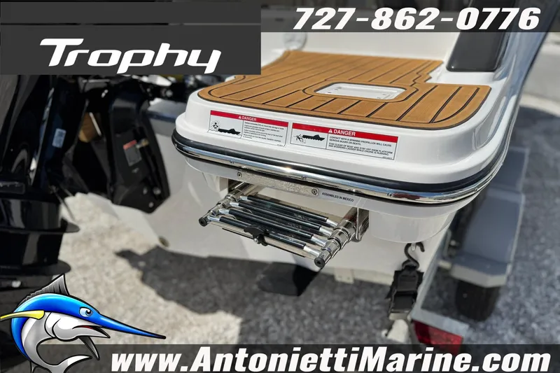 Slide: The Image of 2026 Bayliner Trophy T20CC boat with swim platform and ladder, displayed by Antonietti Marine. - 5