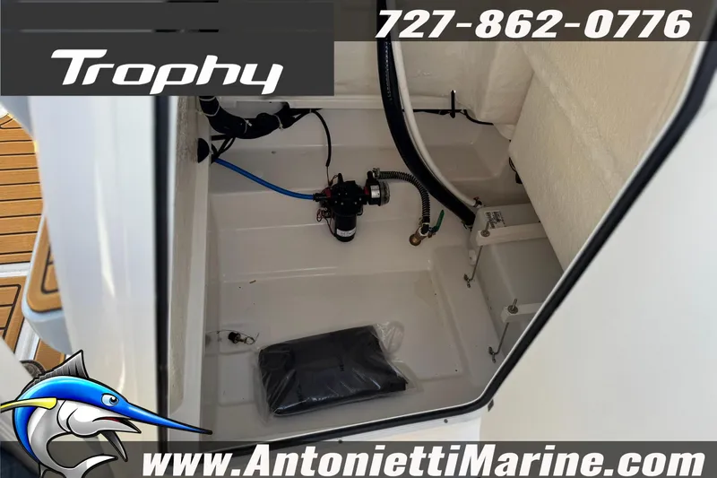 Slide: The Image of 2026 Bayliner Trophy T20CC storage compartment with marine equipment, showcased by Antonietti Marine. - 26