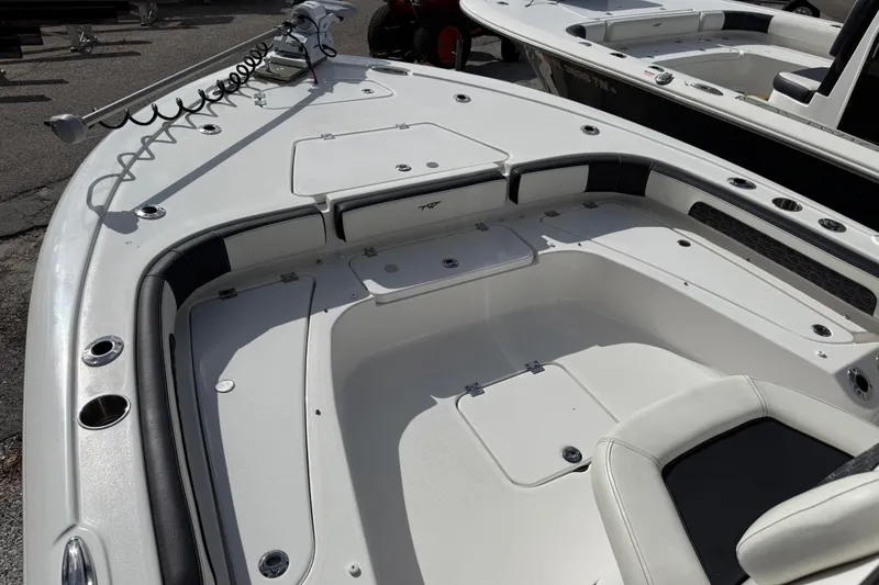 Slide: The Image of 2025 Tidewater 2300 Carolina Bay boat interior with seating and storage compartments. - 8