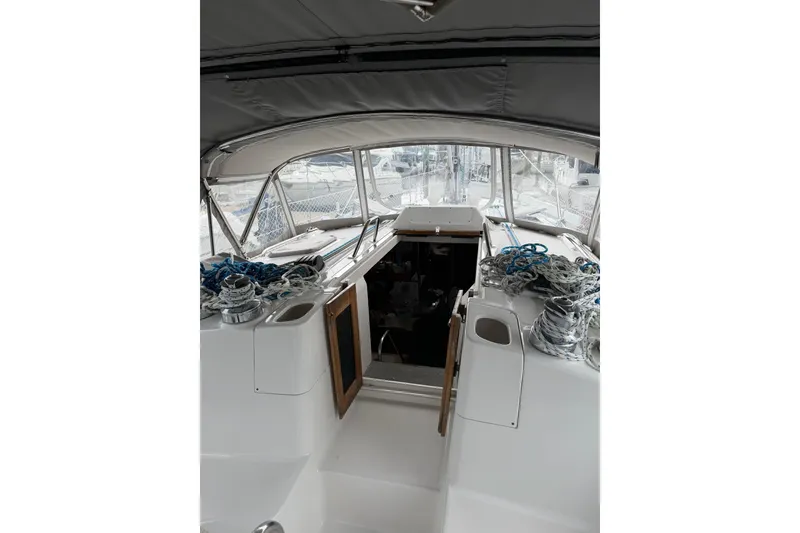 Slide: The Image of Interior view of a 2004 Hunter 466 sailboat cockpit with ropes and winches. - 7