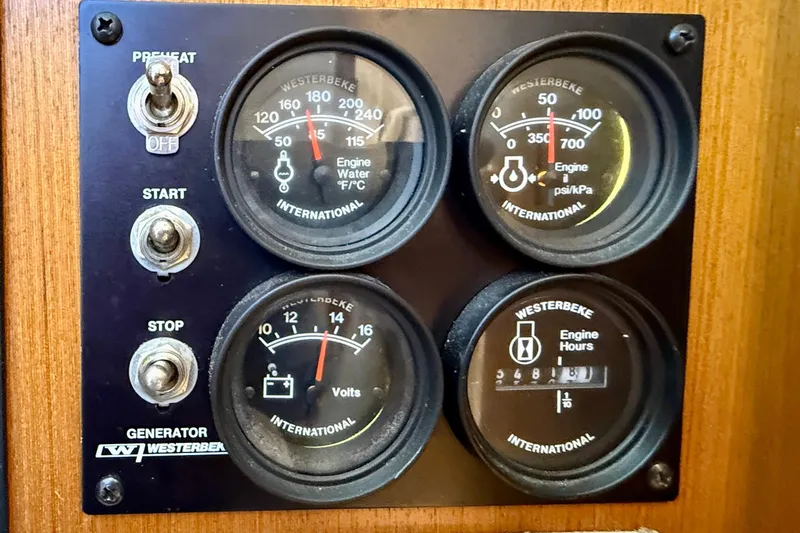 Slide: The Image of Control panel of a 2004 Cabo 35 Flybridge with Westerbeke gauges and switches. - 29