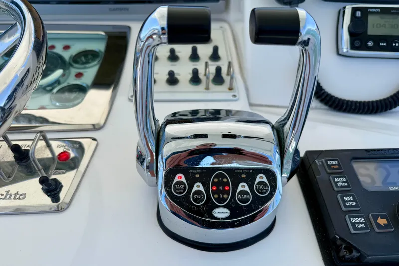Slide: The Image of Close-up of 2004 Cabo 35 Flybridge boat controls and dashboard instruments. - 38