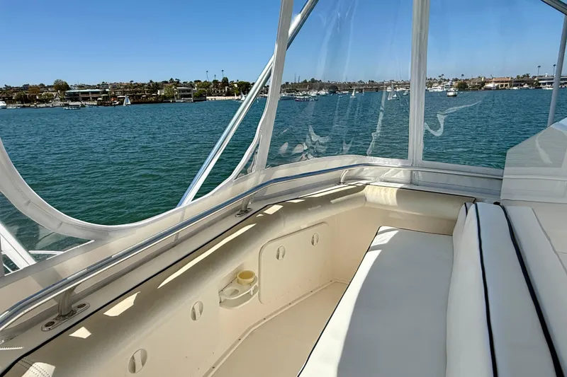 Slide: The Image of 2004 Cabo 35 Flybridge boat interior with waterfront view and comfortable seating. - 40