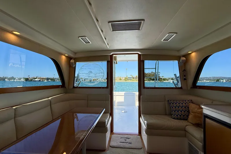 Slide: The Image of Interior of 2004 Cabo 35 Flybridge yacht with waterfront view through windows. - 28